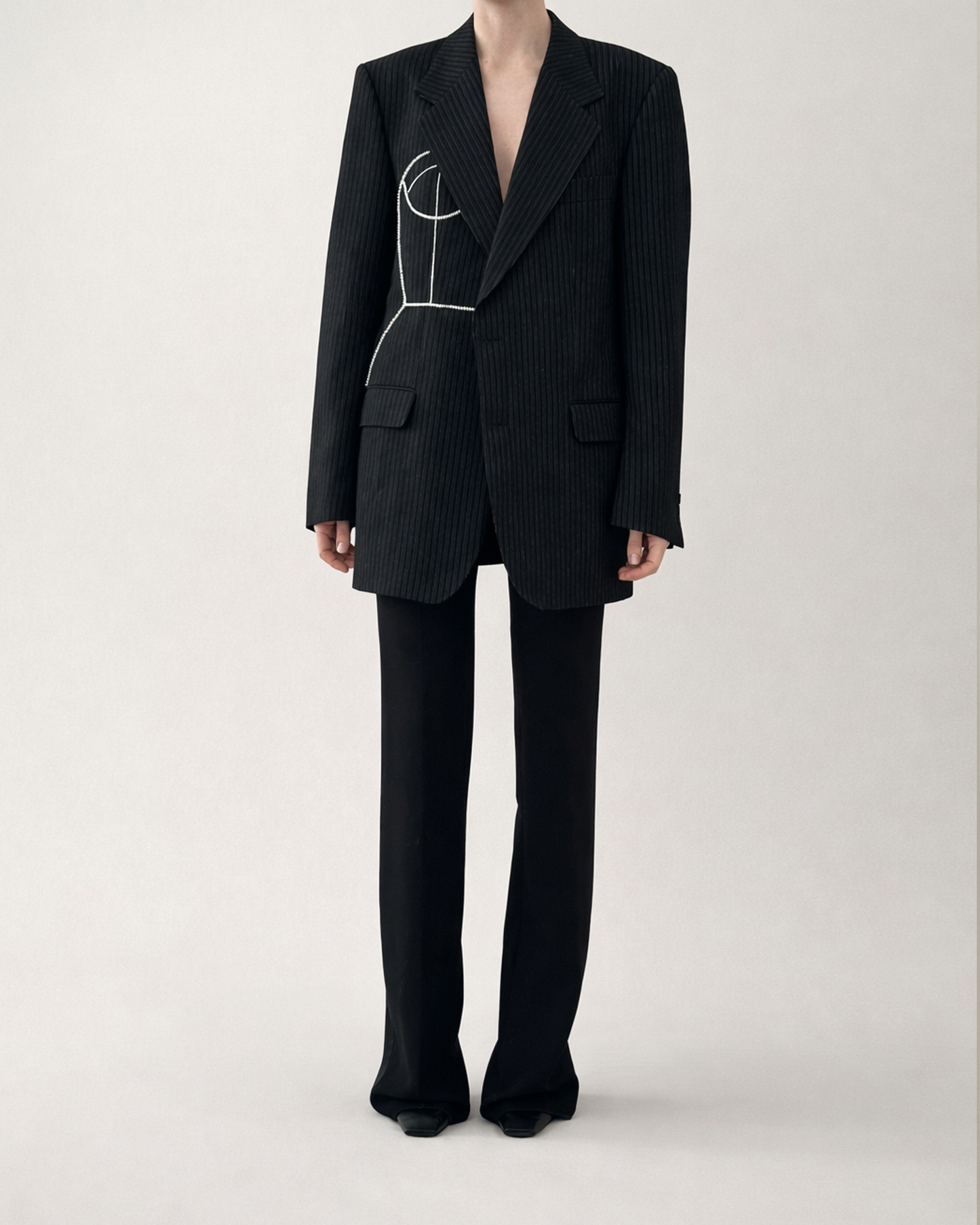BLACK PINSTRIPE WOOL BLAZER WITH HAND-BEADED CORSET DESIGN