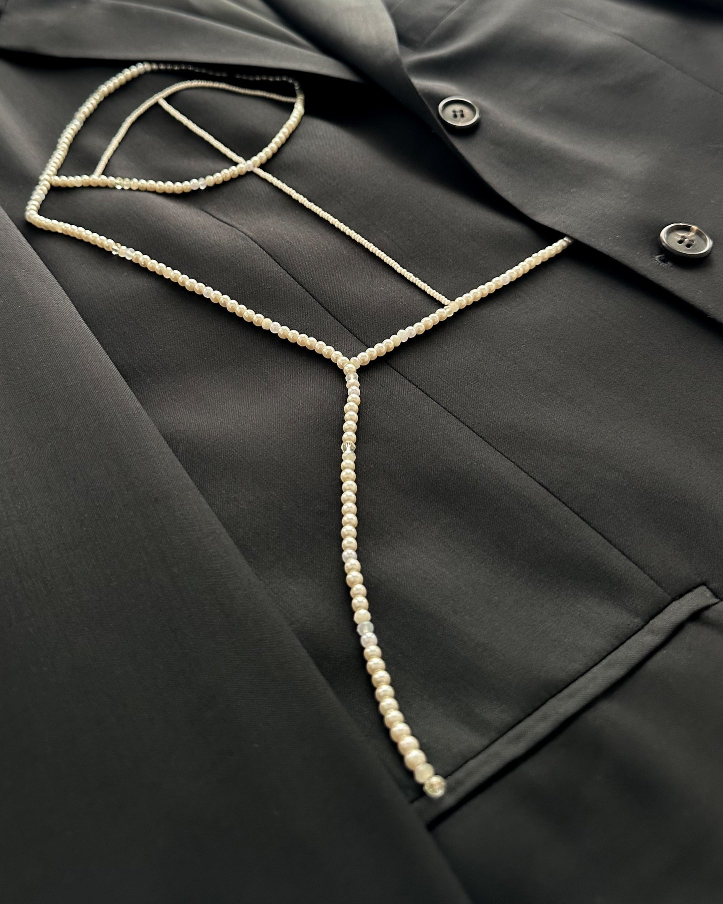 BLACK WOOL BLAZER WITH HAND-BEADED CORSET DESIGN